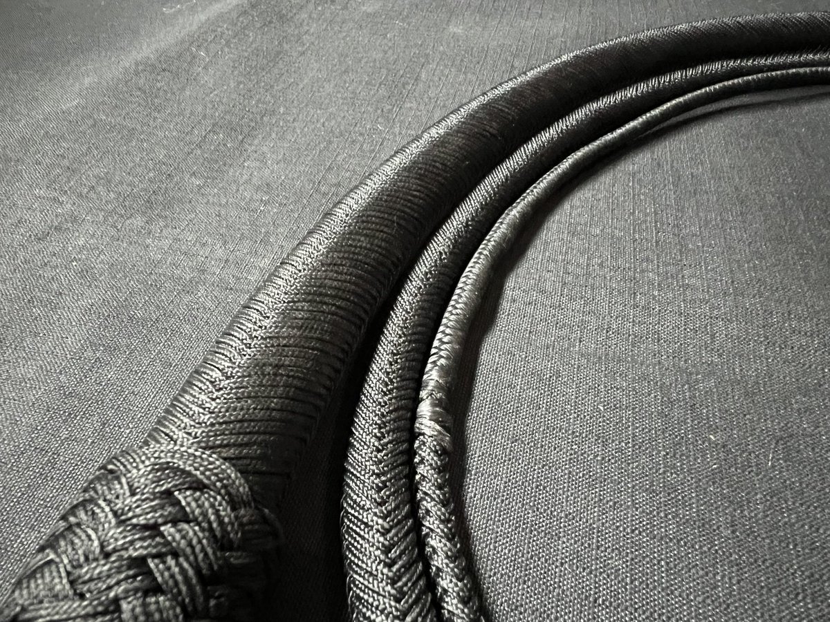AlphaWhips's tweet photo. Custom Order! 

This was a huge project that took a lot of time to build. 
A 32 plait “Alpha Series” 8ft bullwhip with a short 6” handle built in a plain black colour way. 

A heavy slow moving steady whip with a steady taper to the cracker tip. 3 pass 9x8 and 7x6 knots. https://t.co/xOoukozrpL