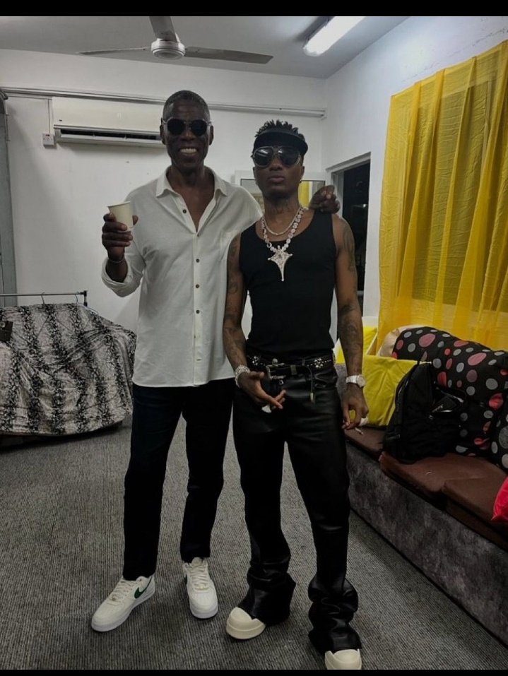 Wizkid Smoking Besides his Father in law . Rules Na For Poor men