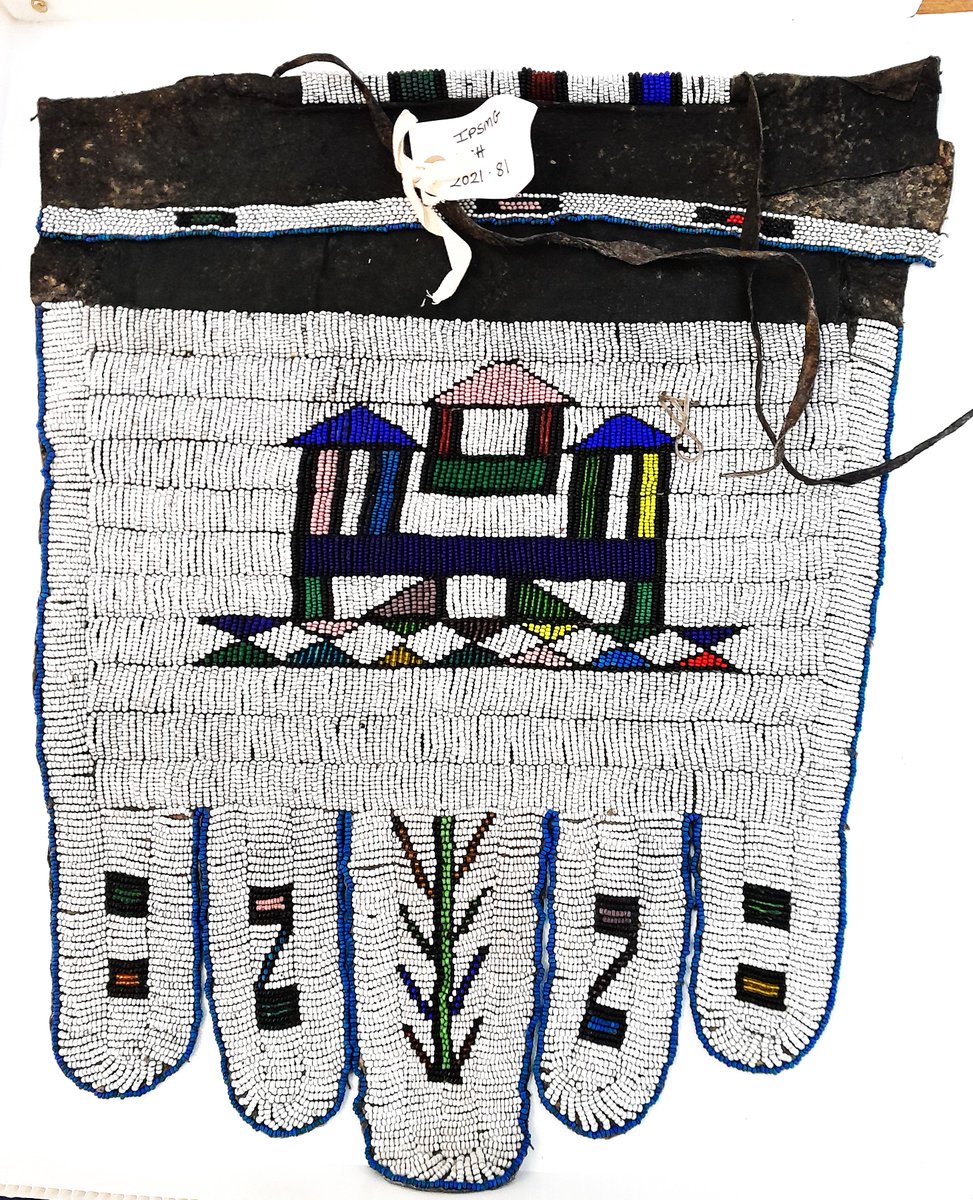 ConservationBob's tweet image. Ipswich Museum. Conservation for redevelopment. Beaded leather apron cleaned with Synperonic detergent and boxed ready for redisplay. Fragile peacock feather fan repackaged. Fan is shedding feather parts. Unfortunately little can be done except to carefully store and display.