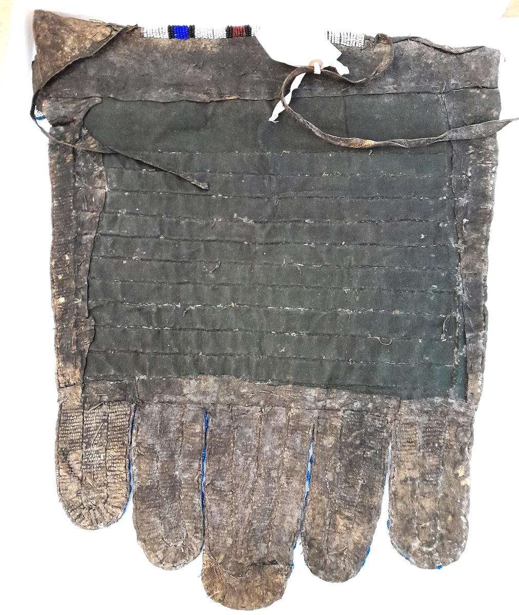 ConservationBob's tweet image. Ipswich Museum. Conservation for redevelopment. Beaded leather apron cleaned with Synperonic detergent and boxed ready for redisplay. Fragile peacock feather fan repackaged. Fan is shedding feather parts. Unfortunately little can be done except to carefully store and display.