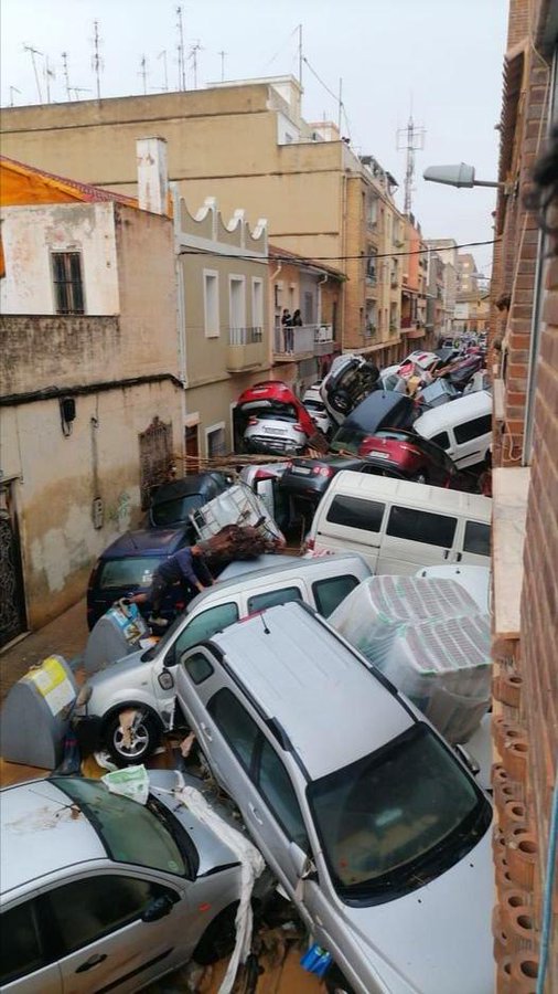 Meteorologists say a year's worth of rain had fallen in eight hours in parts of Valencia on Tuesday.

The resulting flow was so violent it created a river of vehicles that piled up in narrow streets.