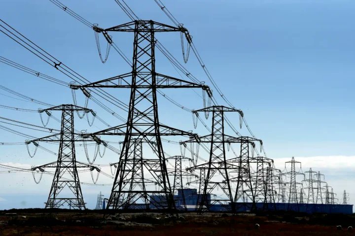 chibuzo_mikel's tweet photo. National Grid: Explaining the complexities and challenges

By Michael Chibuzo

In recent times in Nigeria, the term ‘national grid’ has become part of our popular lexicons. It is common to hear a lot of people say, or even media organisations report that the “national grid has collapsed”. What immediately then comes to the mind of most people is that there is a national blackout.

When this happens, “expert advices” from both the informed and uninformed would start flying around. Opposition politicians also try to cash in by bashing the government in power and indirectly saying that the situation would have been different if they were the ones in power instead.

After going through the commentary of people including those who ordinarily should be better informed on issues pertaining to the national grid and its collapses, I have found out that majority are really ignorant about what the national grid is all about in the first place, not to talk of its operation.

Most people erroneously see the national grid in Nigeria simply as the TCN network of the power sector. As a result of this misconception, I will attempt to explain what a national grid is, x-raying the complexities and challenges especially with Nigeria in focus.

What is an electric power grid?

In a simple language, an electric power grid is an interconnected network for electricity delivery from producers of the electricity (power generation plants) to the consumers of the electricity. In other words, a grid consists of power plants, transformers that step up voltage of electricity produced by the power plants for efficient transmission through transmission lines (high tension lines), electricity substations with transformers that step down voltage of electricity from the transmission lines, distribution substations that further step down voltage of the electricity before supplying to consumers. 

So, in essence, the power grid is a network of power plants, transmission lines and distribution lines. It becomes a NATIONAL GRID if the network extends throughout a nation. If the network is restricted to a region, it is called regional grid. In Nigeria, we have the national grid because there is only one interconnection network that transfers electricity generated from different power stations to electricity consumers passing through the transmission and the distribution networks.

Why do we have a national grid in the first place?

To understand why an electricity grid is necessary, we would need to start by understanding how electricity is produced in the first place and also how it is transmitted from the point of generation to the electricity consumers.

Electricity is produced mostly through the use of a a turbine generator set, which converts mechanical energy to electrical energy. The turbine and the generator are two different devices, which carry out two different functions. The generator however needs the services of the turbine to produce electricity.

A turbine is a rotor shaft with special blades attached to to it and is used to transform the energy of moving water, steam, combustion gases or wind into mechanical energy. The force of the fluid on the blades spins or rotates the rotor shaft of a generator. The generator, in turn, converts the mechanical (kinetic) energy of the rotor to electrical energy (electricity) at relatively low voltage (i.e. tension) of 11.5kV to 16kV.

So, in the gas power plants or the hydropower plants, the work of the gas or water respectively, is simply to force the blades of the turbine to rotate, which then turns the shaft of the generator – the electromagnetic device that generates electricity.

A Thread...👇

1/6