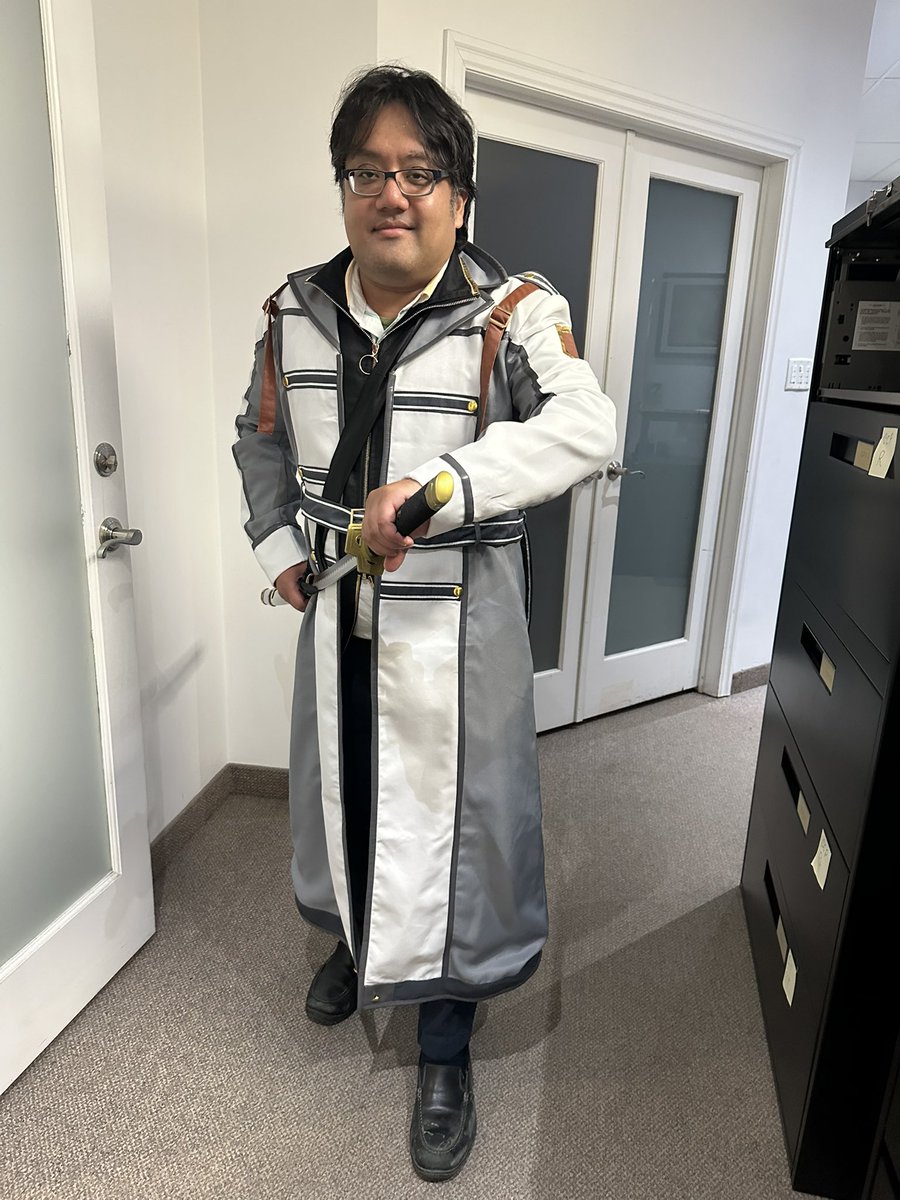 TrailsOfBen's tweet photo. Tried out an Instructor Rean costume I’d ordered during the pandemic.

Not awful, a bit narrow around the shoulders.  So I have a bit better of an idea of what size I should order when ordering from those Asian cosplay sites. https://t.co/kY7W9yWLMu