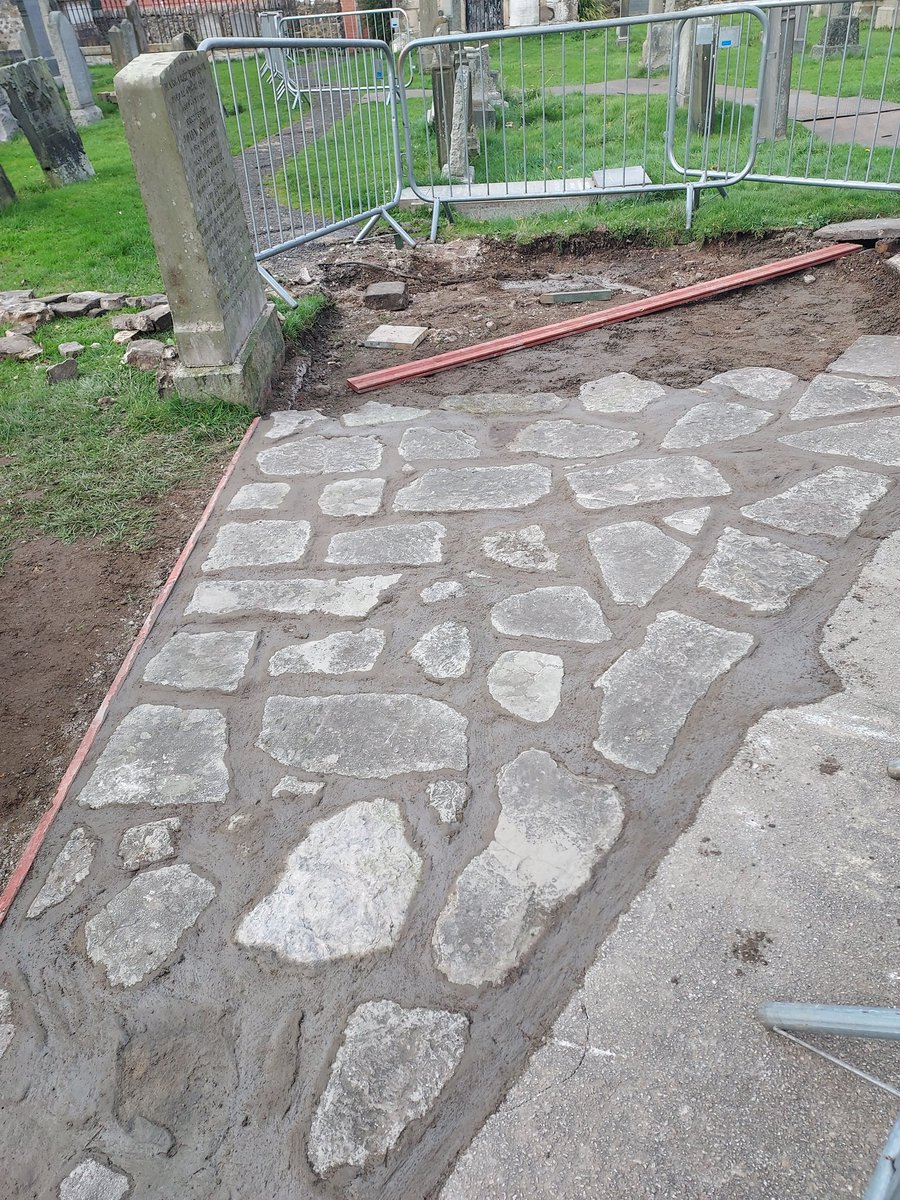 Look at the brand new path in the churchyard. Well, the new old path, being reconstructed by <a href="/Edinburgh_CC/">The City of Edinburgh Council</a> Rumours have been quashed that the old stones formed part of a Roman road because of the electric cable found running underneath it. What have the Romans ever done for us?