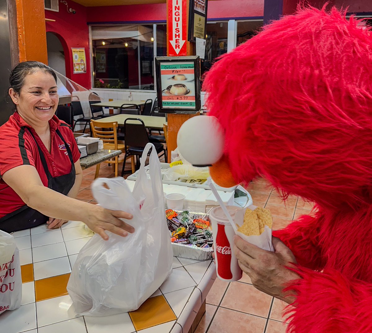KWOOatCa's tweet photo. Halloween Thursday Dinner - His Favorite Mexican Restaurant. Elmo picking up his combo plate - Chicken Enchilada and Chile Relleno https://t.co/aQZ2QvhvA2