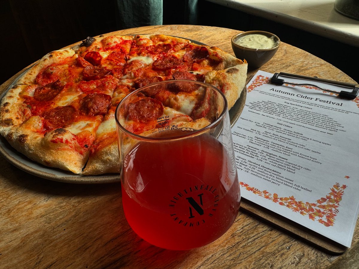 Cider and pepperoni pizza is a wonderful combination. Pictured here is <a href="/NightingaleCidr/">Nightingale Cider Co</a> Fledgling No. 4 made with 100% red love apples: just look at that colour!