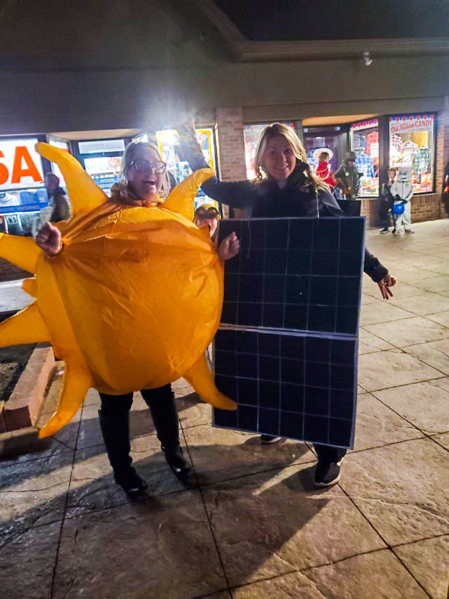 Awesome work from Anna Weddle, showing our passion for solar this Halloween! 🎃 She even lucked out to find a sun costume to pose with her! #halloween #solar #solarenergy #solarpanels
