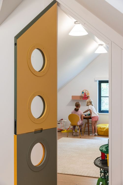 At our award-winning Greenwich Passive House Renovation, we captured unused attic space above a bedroom to create a light-filled playroom. #greendesign #greenbuilding #netzero #buildbetter #architecture #sustainablearchitecture #trilliumarchitects #greenarchitect #passivehouse