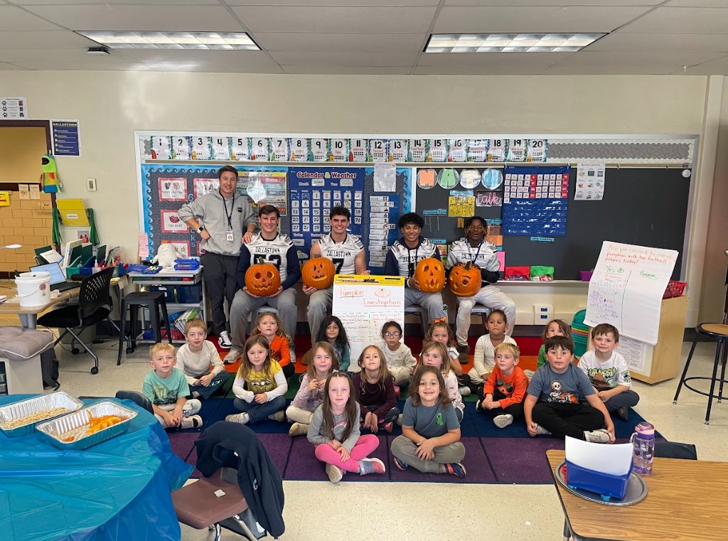DallastownSD's tweet photo. Pumpkins and pigskin! Our high school football players teamed up with Mr. Andrews' kindergarten class at #YTE for a hands-on pumpkin investigation! It was a field trip in their classroom, blending big-kid leadership with curious, little-kid wonder. https://t.co/0SsbVr9T03