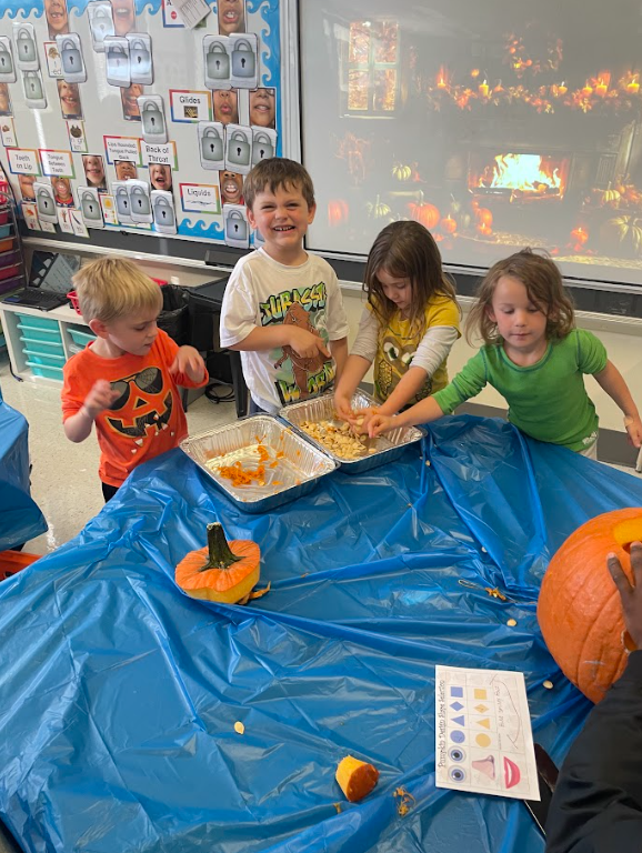 DallastownSD's tweet photo. Pumpkins and pigskin! Our high school football players teamed up with Mr. Andrews' kindergarten class at #YTE for a hands-on pumpkin investigation! It was a field trip in their classroom, blending big-kid leadership with curious, little-kid wonder. https://t.co/0SsbVr9T03