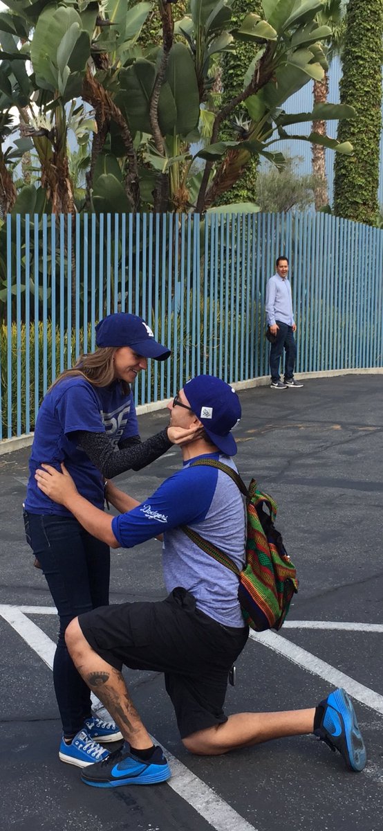 CarlyleDuffield's tweet photo. Before game 7 in 2017, I snapped a photo of this couple getting engaged outside Dodger Stadium. Hope this photo finds it way to them, &amp; hope this week’s celebration is only the 2nd or 3rd best thing to happen to them in the last 7 years.   @PetrosAndMoney @THEREAL_DV @Dodgers https://t.co/oRr8AKcUgO
