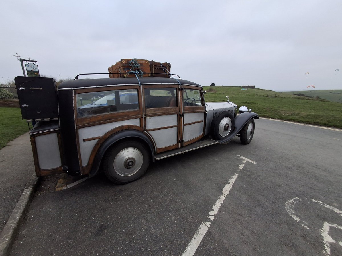 StephensLDN's tweet photo. A very odd looking car at #DevilsDyke this afternoon. Looked kind of home made and cobbled together. Maybe it was really a vintage Rolls Royce. But parking it had clearly been a challenge. https://t.co/Vv46pwblJh