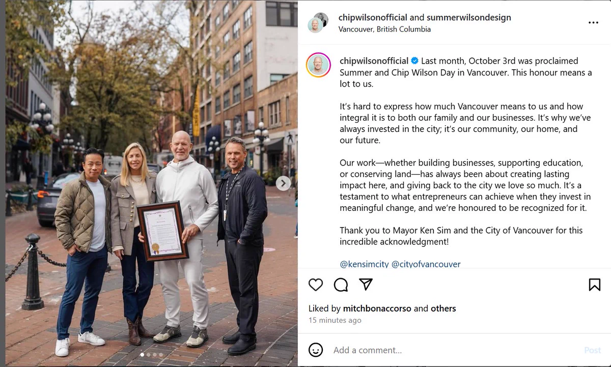 Mayor Ken Sim and Councillor Brian Montague flank Chip Wilson and wife holding proclamation declaring Chip Wilson Day, while standing in Gastown 