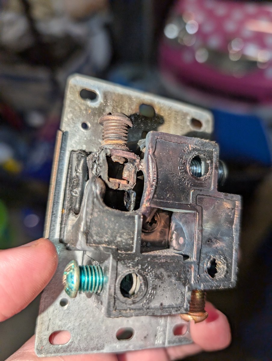 Lomilar's tweet photo. @tommolog Another Leviton 14-50 socket failure. What sucks is that I bought a Hubbell 14-50 socket because I was going to swap them out but haven't gotten to it. Now it looks like the wire insulation is all fried and my EVSE plug is charred. Who's that sponsor again? https://t.co/jc1jN5Utsv