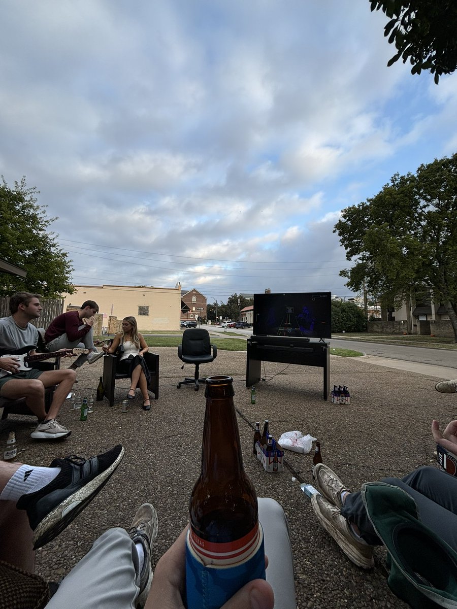 Somewhere_Hot's tweet photo. Guitar hero, couch, and beers. Kamala hates this America https://t.co/T0BoGZ8oPN