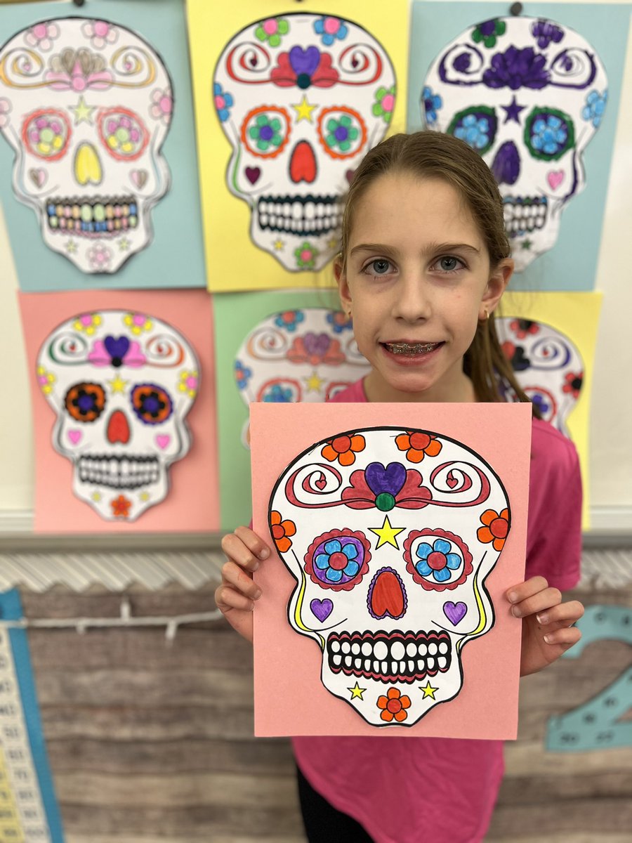 ClassWithMissK's tweet image. Today we learned about Dia de los Muertos! Students created a sugar skull and included facts about the celebration underneath. 💀
