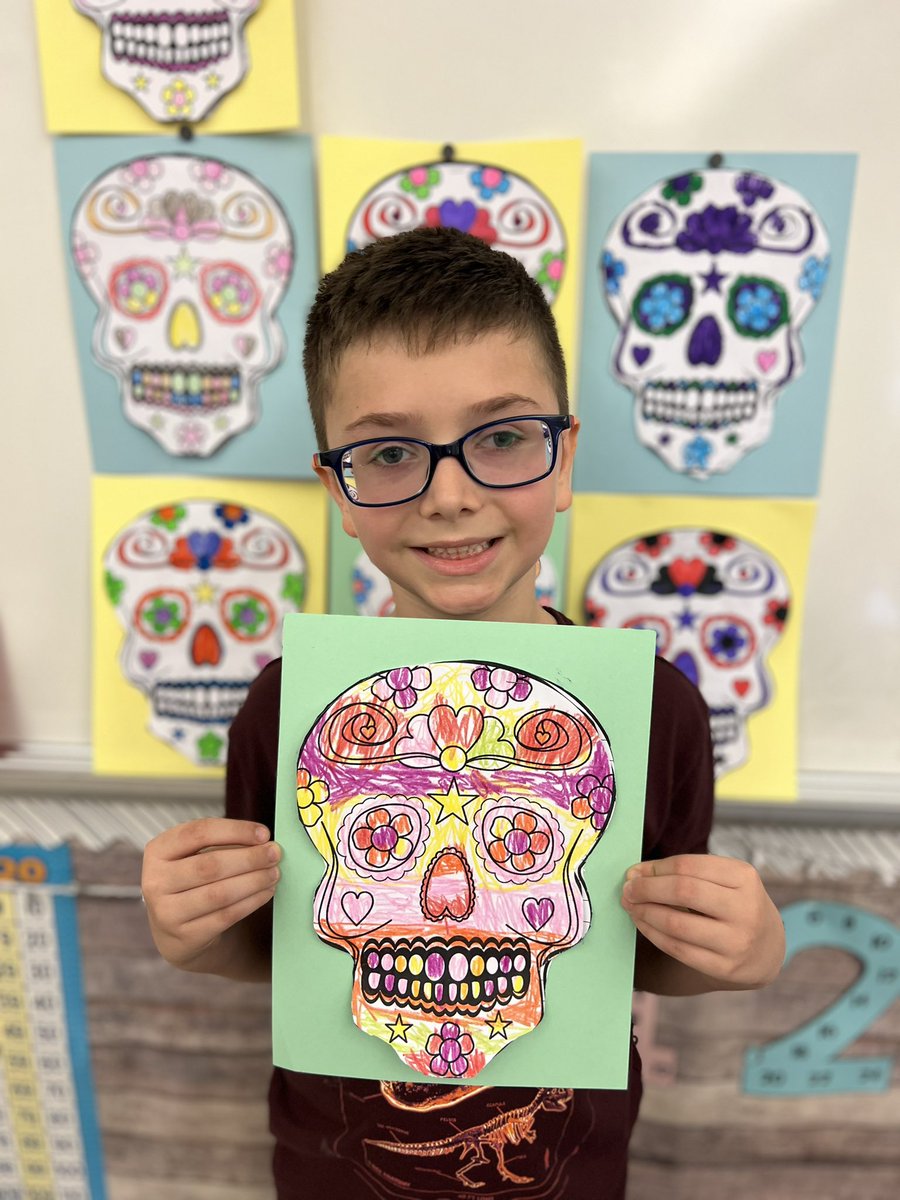 ClassWithMissK's tweet image. Today we learned about Dia de los Muertos! Students created a sugar skull and included facts about the celebration underneath. 💀