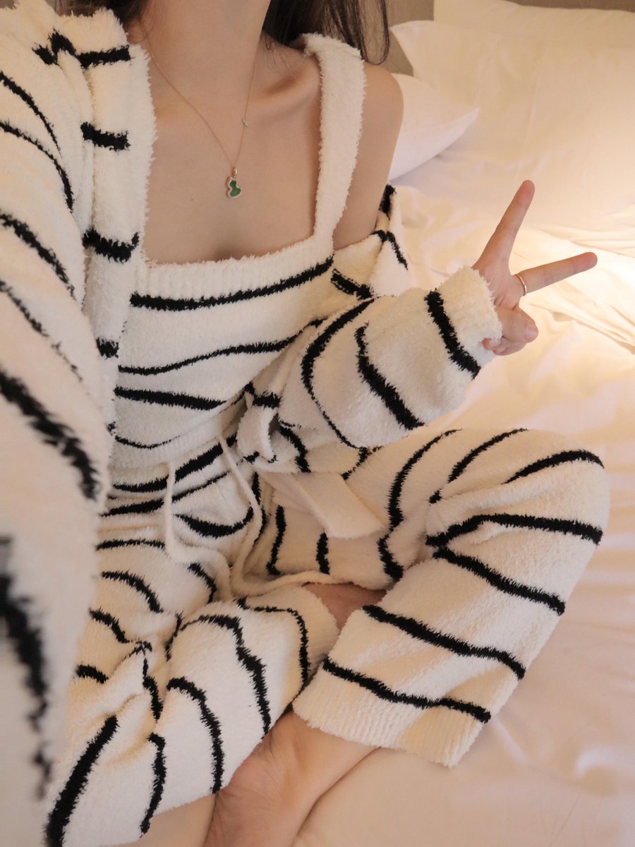 Embrace stylish comfort in striped pajamas for a cozy unwind after a long day. 🌙✨