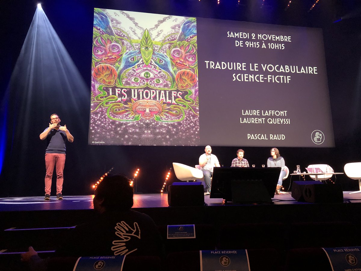 Marion Sabourdy sur Bluesky 🦋 (@fuzzyraptor) on Twitter photo Traduire le vocabulaire science-fictif - avec <a href="/marshotel/">Laurent Queyssi</a>, <a href="/LaureLaffont/">Laure Laffont</a> et Pascal Raud (conférence interprétée en LSF) #Utopiales2024 Traduire le vocabulaire science-fictif - avec <a href="/marshotel/">Laurent Queyssi</a>, <a href="/LaureLaffont/">Laure Laffont</a> et Pascal Raud (conférence interprétée en LSF) #Utopiales2024