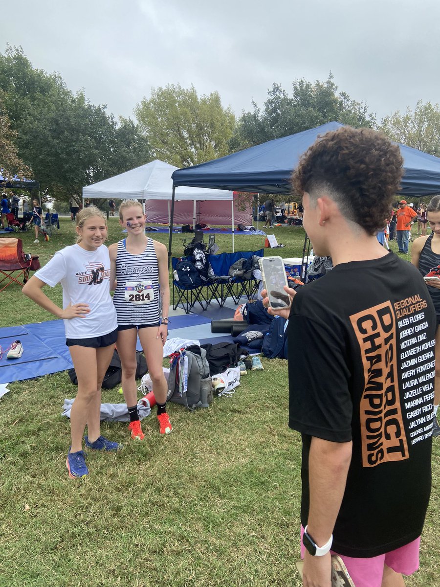 hinojosa_david's tweet photo. Scenes from #UILState cross country: Randolph’s Sophia Bendet and Aubrey Milam pose with their medals; Boerne Champion’s Elizabeth Leachman takes a photo with a fellow runner; Smithson Valley girls pose with their Class 5A state trophy. https://t.co/sZ1JrmzD86