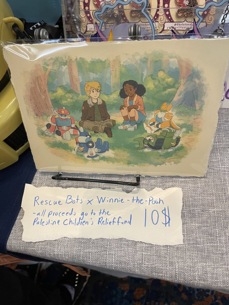SkeletonDeer's tweet photo. Thanks to everyone who bought our Rescue Bots print!!!
So far we’ve made 80$ to give to the Palestine Children Relief Fund !
We’ve still got some for Sunday at my, @the_bowen_arrow &amp; @Punch_chinsky ‘s table at TFCon! https://t.co/4VcqRPtLH2