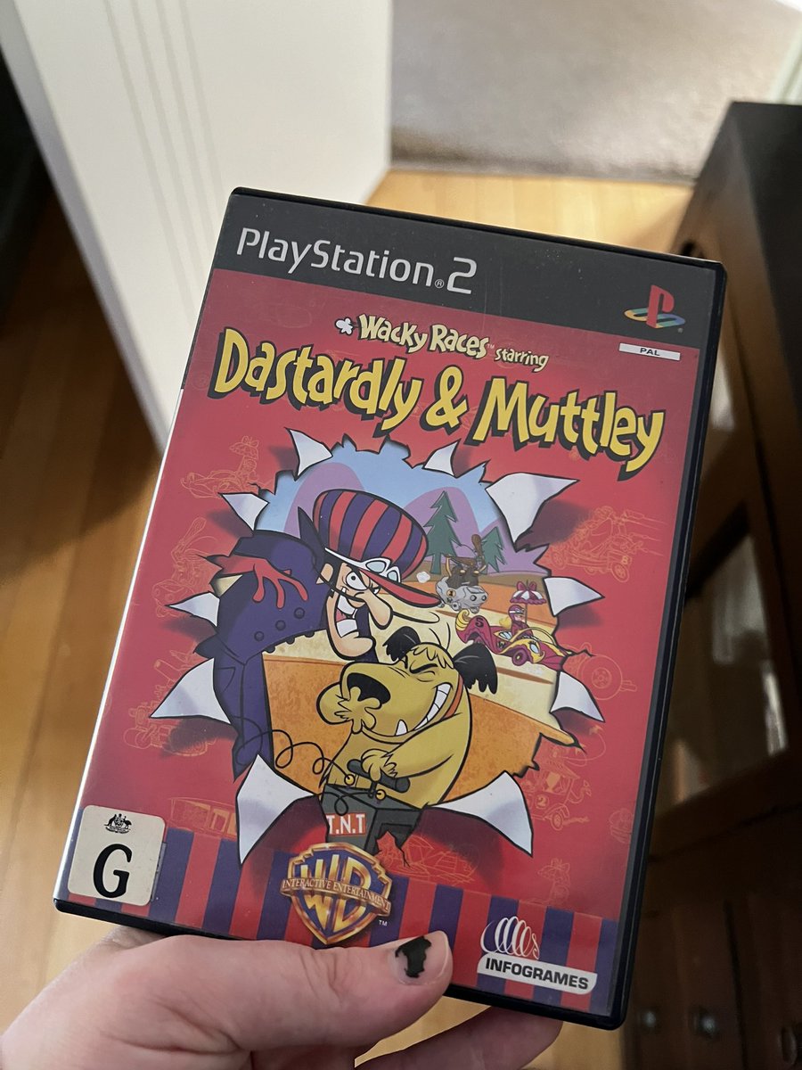 my dad got our playstation 2 working and is having the time of his life playing wacky races :D