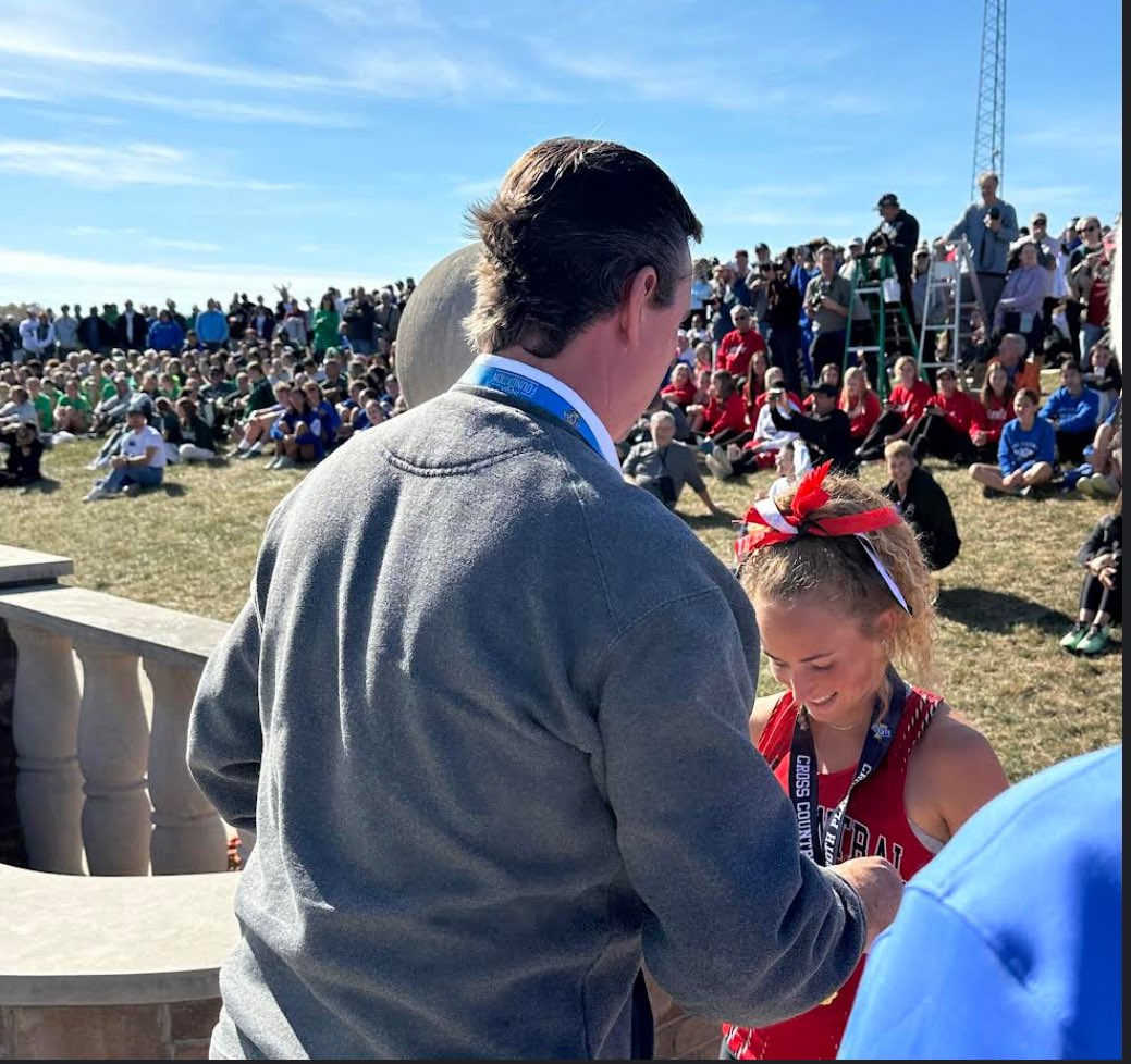 ECTrojanSports's tweet photo. Today’s IHSAA State Meet:
@ecxcountry Team finish (21st place) 

Callie Bentley (Jr) hit the podium for the 2nd year in a row with a 20th place finish.  She finished 23rd last year. 

EC Principal, Tom Black, an IHSAA board member, was able to present her w/ her medal! https://t.co/Nh9RubVdnm