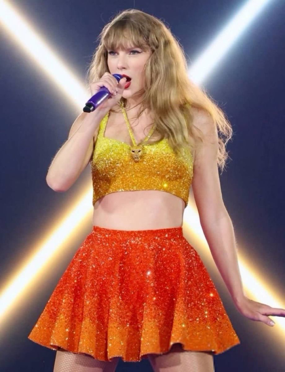 | Taylor Swift stuns in yellow/gold top orange skirt outfit for the "1989" era at today's show in Indianapolis! #IndyTSTheErasTour | Taylor Swift stuns in yellow/gold top orange skirt outfit for the "1989" era at today's show in Indianapolis! #IndyTSTheErasTour