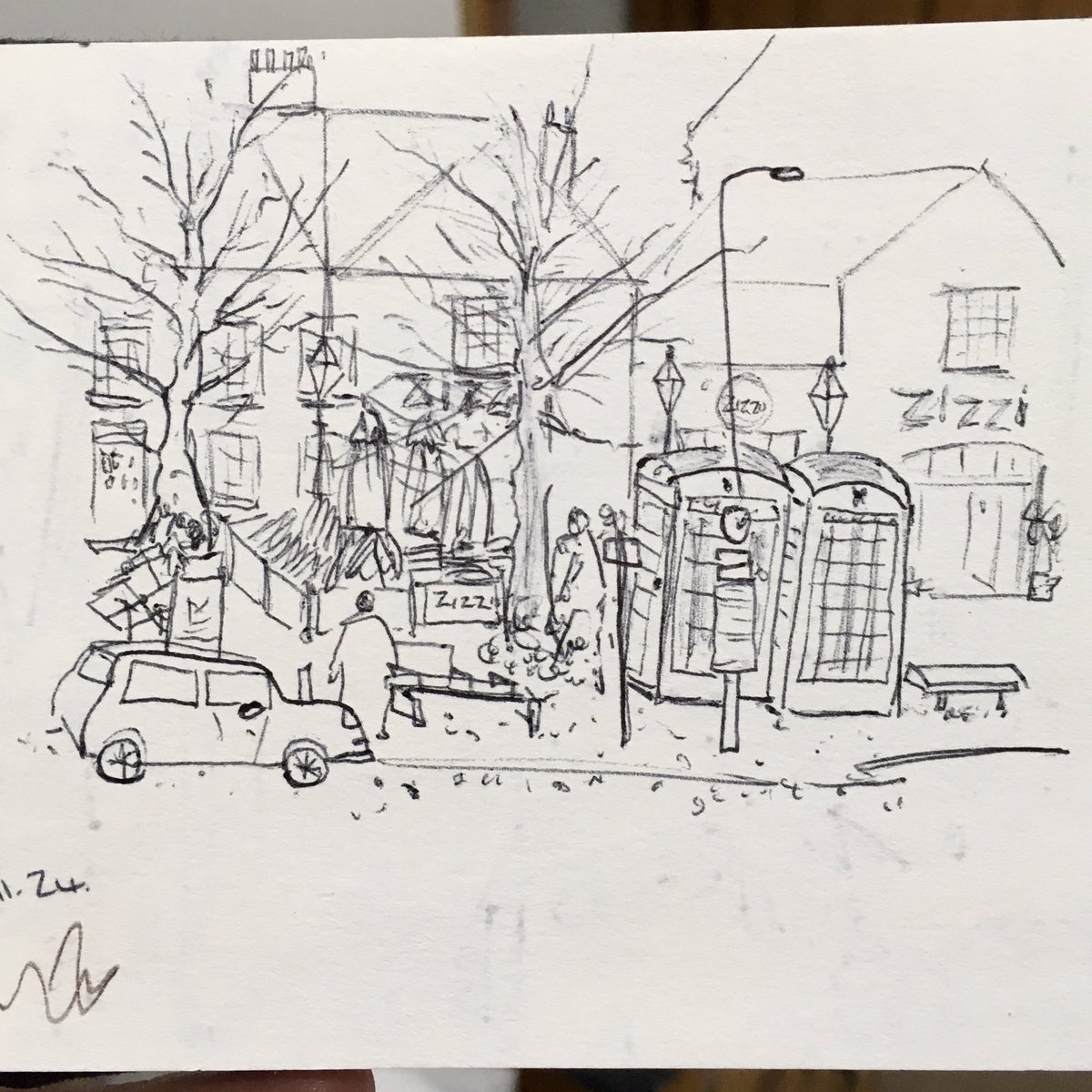 neildavison1969's tweet photo. Tombland sketchbook in hand drawing waiting for the bus. 
I can confirm that it’s not an actual tiny car and giant phone boxes, it’s just my dodgy drawing proportions. 
#dailydrawing #tomblandnorwich #sketchbook #Norwich #tinycar #ArtistOnTwitter #ArtistOnX #thedailysketch https://t.co/IaByn5c7Va