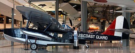 MCCCANM's tweet photo. “Air Force One” – the airplane that flies the President around – traces its roots back to 1933, when FDR was the first President to fly while in office (Teddy Roosevelt had flown in a Wright Flyer in 1910, but had already finished his terms…legend).

The first aircraft used was a Douglas “Dolphin” amphibious aircraft (meaning it can land on water or a runway), specially outfitted for luxury, w/ a separate sleeping compartment. It remained in service until 1939; when it was retired, it was not immediately replaced.

Instead, the President relied upon commercial airlines, though they were often chartered. During WWII, air travel – which didn’t have a great safety record – was still considered safer than traveling by ship, due to the German U-boat threat. 

By 1943, the military decided they needed a dedicated transport. They modified a version of the B-24, but the Secret Service was adamant the airplane was not safe; crews of the B-24 in WWII had taken to calling it the “Flying Coffin” & a “Widow Maker”; it was a difficult airplane to fly, especially at low speeds. It also was basically a bomber, which probably wasn’t the image they were looking for.

A C-54 “Sky Master” was soon refurbished & dubbed the “Sacred Cow” for use by FDR. It included a battery powered elevator to lift FDR in his wheelchair.

After FDR’s death, Truman used the “Sacred Cow” extensively; he even signed the National Security Act of 1947 aboard it, making that airplane the birthplace of the US Air Force. It’s on display at the Air Force Museum in Ohio.

Shortly after, the C-54 was replaced by a 
C-118 “Lift Master” dubbed the “Independence”. It was, of course, well-furnished; a distinctive Eagle paint scheme was put on the nose. 

In 1953, a Lockheed “Constellation” – one of the sexiest airplanes ever – entered regular service for the President w/ the moniker “Columbine II”. It became the first aircraft to carry the call sign “Air Force One” after an incident in which the normal call sign based on serial number – in this case, Air Force 8610 – entered an air traffic control area with an aircraft carrying a similar callsign (Eastern 8610…similar callsigns can cause confusion & safety hazards).

(“Air Force One” as a callsign can only be used when the President is actually aboard…in most other cases, they carry a callsign beginning with “SAM”, for Special Air Mission)

By 1959, the government recognized a need to upgrade to jets; the Soviets were using them, so it was considered undignified for the Americans to show up in a propellor driven aircraft. They adopted the Boeing 707; a few early models were used, but they were not painted in a livery associated with the United States. Some of the Lift Masters remained, though, & served as the primary transport for domestic trips.

After Kennedy took office, his wife contacted a designer for help on the layout & livery of the new 707s in 1961. The result was the distinctive blue & white paint scheme that persists to this day. It flew for quite a while, with minor interior changes from each administration.

Under Reagan, the 747 was ordered as a replacement for the 707, though the 707 would continue to serve until 1998; which airplane was used depended on the mission. The 747s began service in 1990 & have become “the” Air Force One. Replacements for the original 747s are expected in 2026; the 747 production line has been shut down for a while, but two never-used 747s were located for a retrofit; ironically, they’d been originally ordered for a Russian airline that filed for bankruptcy before delivery.

It’s a misnomer that Air Force One is always accompanied by a fighter escort; that does happen periodically, but it’s not the standard.

Pilots who want to fly AF1 apply to the 89th Airlift Wing; they are interviewed & selected. They don’t start out on AF1…they work up to it in various different platforms transporting other dignitaries. It’s a prestigious job & not easy to get. It’s a big deal for your résumé.