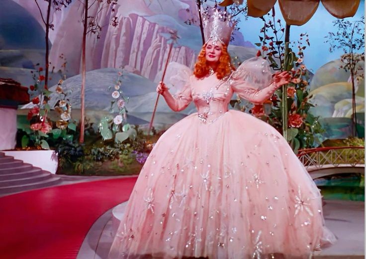 saintdemie's tweet photo. ariana grande wearing vivienne westwood at the australian premiere of ‘wicked’, referencing billie burke’s original glinda in ‘the wizard of oz’ (1939) 💗⋆｡˚ https://t.co/0xFGKXKX9T