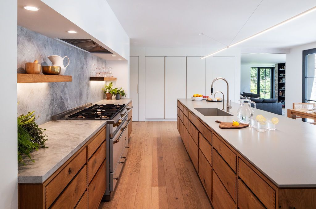 TrilliumArchite's tweet photo. At our award-winning Greenwich Passive House Renovation, we moved the entire kitchen! The original dark and dated kitchen was in a back corner of the house. We moved it to the center of the home, creating a beautiful, open space- perfect for busy family life and entertaining. https://t.co/eM9lBY0q5n