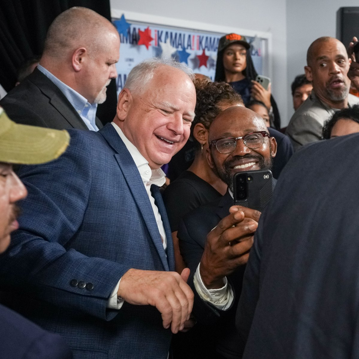 Tim_Walz's tweet photo. Momentum is on our side. And I know we can win – because we have this team.

Got a chance to thank these folks for knocking doors in Georgia.

Let’s get this done: https://t.co/cmQcdjut06 https://t.co/1snSOSCT9D
