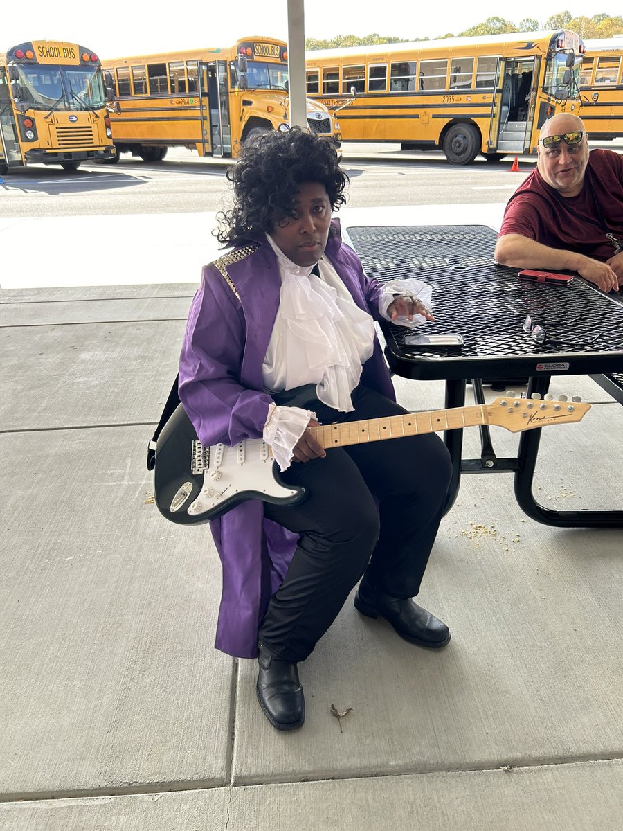 DealElementary's tweet image. Our Tigers rode the bus home with Prince, the Flash, and a scarecrow on Halloween!  #schoolbusdriversrock #halloweencostume #gotigers