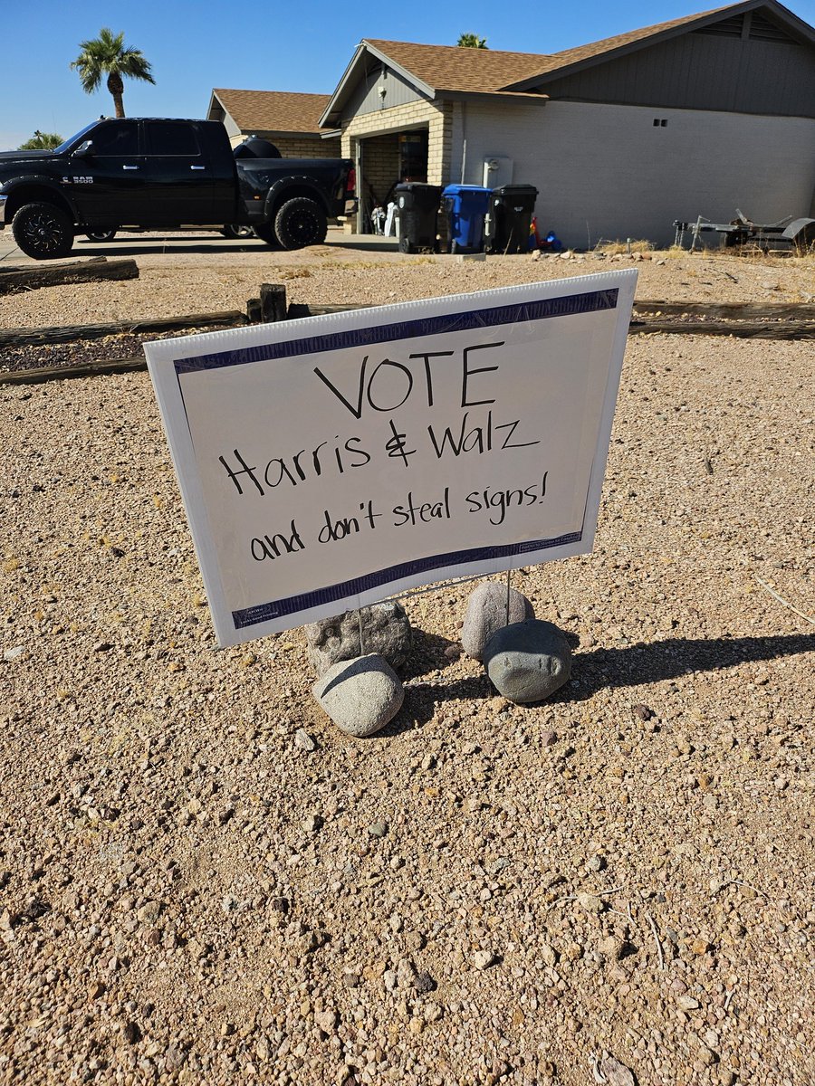 purpleadam4's tweet photo. The sign on the left was originally in our front yard. The sign on the right is what we put up after our Harris sign was stolen. Neighbor also had theirs stolen. To the @realDonaldTrump supporter who stole them, enjoy losing on election day.
#Harris_Walz2024
#GarbagePeople 
#Vote https://t.co/vsHPxEXsYL