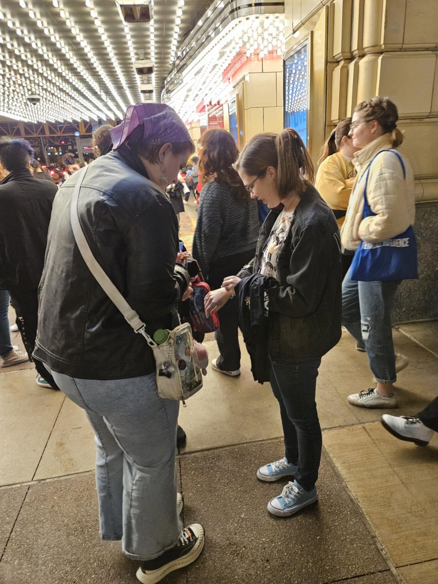 LikeMaidMarian's tweet photo. Here's me desperately trying to be social and asking to swap bracelets with people at #titchicago. Sneaky photo cred: @Blind_Ramblings https://t.co/PGGP8TCHwk