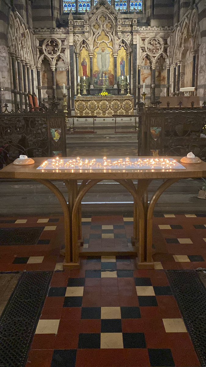 Candles left on the altar from our All Souls service last night have been relit again today. Each candle a memory of a beloved soul.