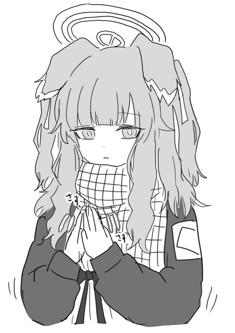 手をさすって温まる塚 