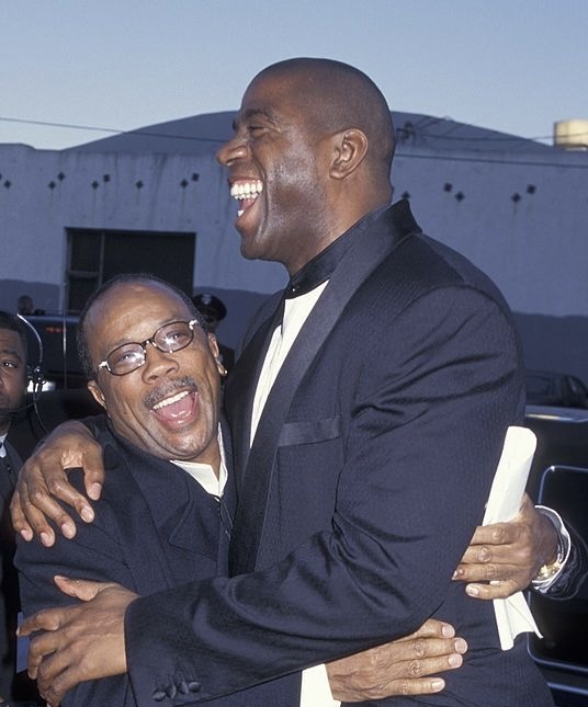 MagicJohnson's tweet photo. I’m deeply saddened to learn of the passing of my good friend and an all-time icon, Quincy D. Jones. Quincy had an exceptional ear for music. Through his incredible talents as an artist, composer, and producer, he exemplified true artistry and innovation throughout his unrivaled career. There will never be another Quincy D. Jones!

Quincy’s success as a producer is truly unmatched. His extensive production credits speak volumes about his impact on music history, having collaborated with the biggest music icons in the world such as Aretha Franklin, Frank Sinatra, Nat King Cole, Paul Simon, Amy Winehouse, and Barbra Streisand, to name just a few. And we all know about Quincy’s legendary work with Michael Jackson, where he produced three groundbreaking albums: Off the Wall, Thriller, and Bad. Thriller remains the biggest-selling album of all time! As a composer, Quincy’s score for the 1985 film The Color Purple earned him an Oscar nomination. He also recorded a series of albums featuring stars like James Ingram, Ray Charles, and Chaka Khan. Quincy was one of the wealthiest African Americans in the world, thanks to his ownership of the rights to the music he produced, which showcased his strong business acumen alongside his artistic genius.

Quincy Jones' legacy goes far beyond his musical achievements; he had a God-given gift for connecting people through music, which he used to make the world a better place. A perfect example of this is the infamous 4x Grammy Award-winning song “We Are the World,” the star-studded song written by Michael Jackson and Lionel Richie which he co-produced and conducted. His influence and contributions to music will resonate for generations to come, and his legacy will live on through the lives of his seven successful and talented children, whom he often spoke of with great pride. Cookie and I are keeping the entire Jones family in our thoughts and prayers during this difficult time.
