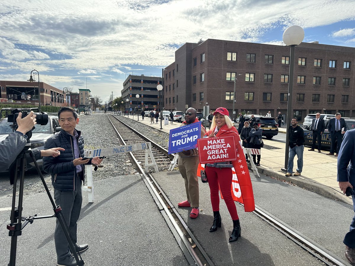 Tralinj's tweet photo. Trump Rally Reading, PA Nov. 4, 2024  Foreign reporters interviewed this couple on their way in to the rally. #diversity #election2024 https://t.co/FKQJg8UzNA
