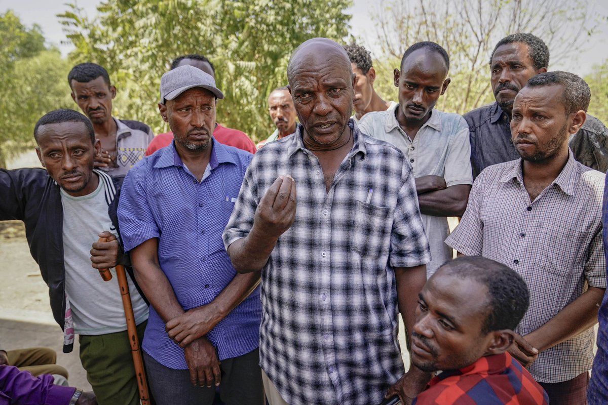 JemalCountess's tweet photo. Now we know the planning was done more than 2 weeks ahead of the massacres……
MAI KADRA, ETHIOPIA - MARCH 05, 2021:  Several day laborers who worked at farms in and around Mai Kadra gather to recount the November 2020 attacks at Mai Kadra while speaking to a journalist on March 5, 2021 in Mai Kadra, Ethiopia.  Dawit Kasdu (off camera) and his fellow day laborers and farmers all agreed when Dawit said "I believe that this was well planned and planned very far in advance, if not before two weeks. They started to tell those Amhara farm workers who were not being permitted to go to their work places you need to have a permit to travel to your work place. The wealthy Tigrayans who owned farms didn't pay their laborers their wages and withheld them because they knew the genocide was coming. There are indications that they knew everything that was planned and that was going to happen. I believe the local Tigrayans knew as well. I also know that Tigrayan Special Forces were arriving in Mai Kadra during the days leading up to the massacre.  But the first to be killed were those who lived and worked on the farms, who had been on the farms or in the fields. Their murders were hidden from the local people and the farm owners and officials who killed them used tractors to dump their bodies in ditches or the forested areas outside of the city like the Mai Kadra River or the fields at Shelela Mocha on the outskirts of Mai Kadra." According to interviews conducted in recent days with several dozen victims, witnesses and local officials, around 1,300 (now over 1600) ethnic Amharas were killed during a series of attacks by the Samri TPLF (Tigray People’s Liberation Front) Youth Group, TPLF militia and local Tigrayan police, from November 6 to November 10, 2020. The violence occurred during a wider conflict between the Ethiopian government and the TPLF that ignited on November 4, 2020, when forces aligned with the TPLF conducted surprise attacks on the Ethiopian National Defense Force (ENDF) Northern Command headquarters in Mekelle, the capital city of the Tigray region as well as 4 other military bases and over 100 soft targets. (Photo by Jemal Countess/Getty Images) @Joe__Bassey
@jerryuscongress
@Chriseldalewis
@dom_lucre
@jimmy_dore
@TheAfricaReport @LemkinInstitute @AfricanHub_ @african_stream @CollinRugg @RepJames @RepJamesComer @SFRCdems @SABCNews @SABCNews_Radio @xhnews @francescaronch
@TasetiReloaded2
