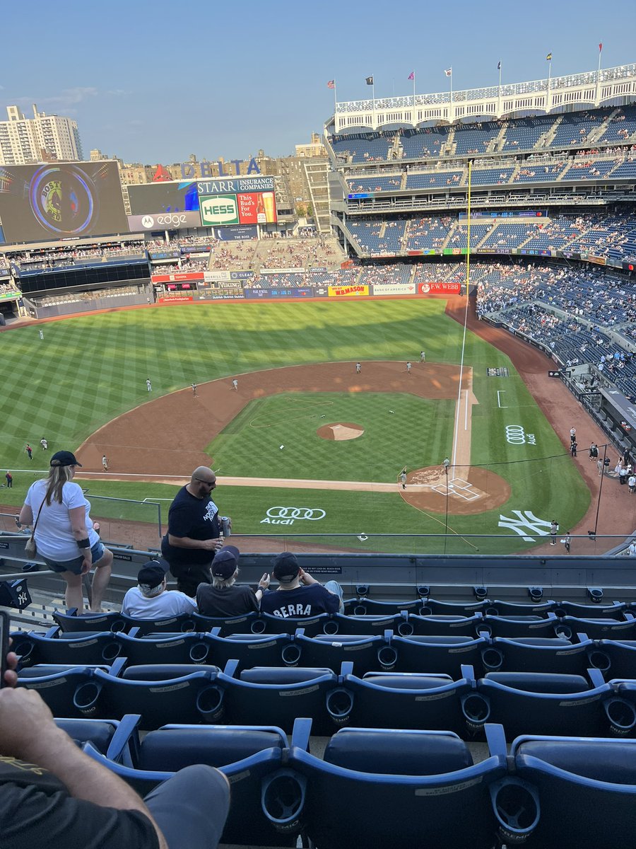 I like being up a bit higher so that I can see everything. 

First few rows of upper level between the bases is my sweet spot. Such as…