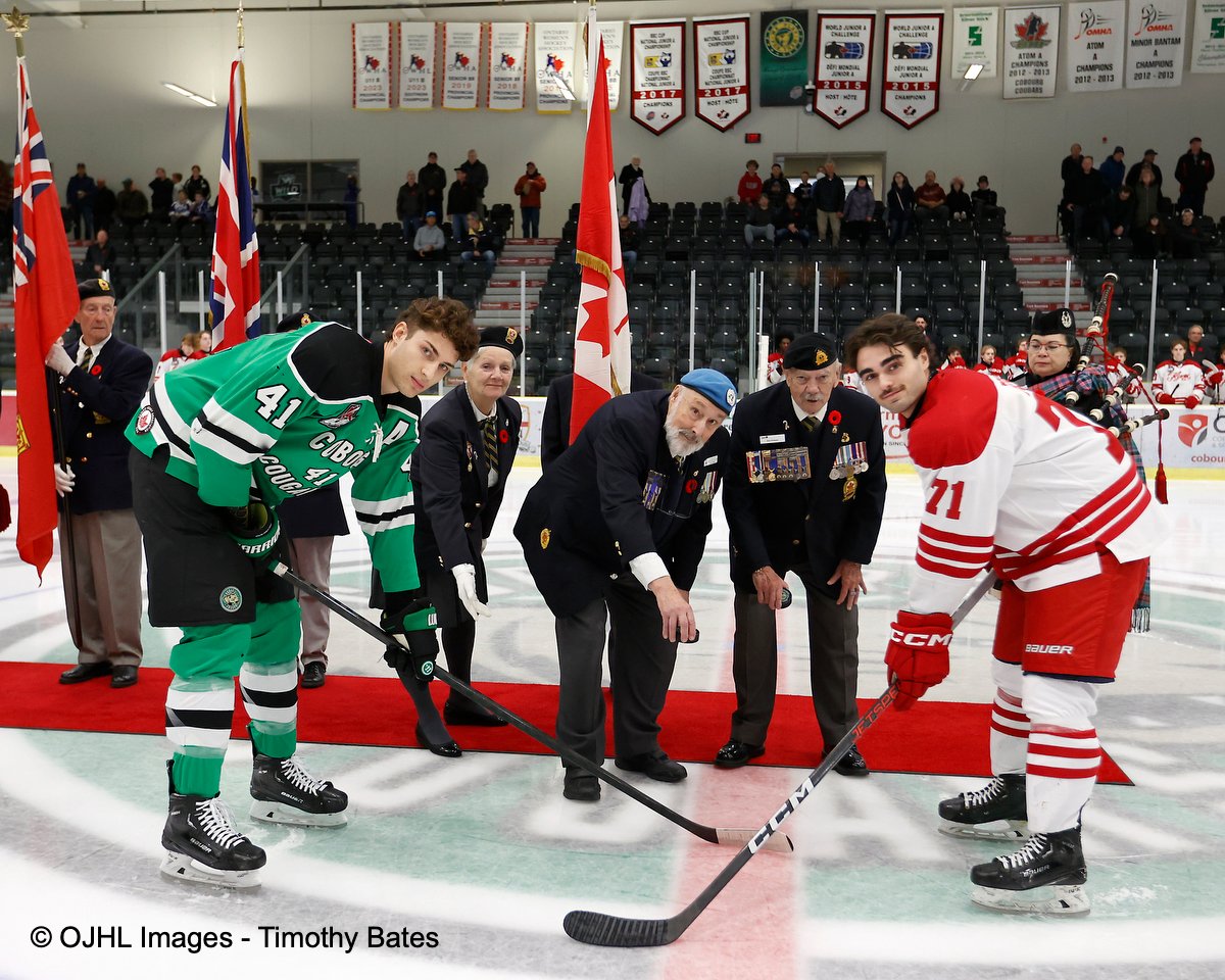 OJHLOfficial's tweet photo. Members of the Royal Canadian Legion Branch 133 Cobourg participate in a special pre-game ceremony in honor of Remembrance Day. Accompanied by both Team Captains. @CougarsHockey @LeamFlyers #juniorhockey #officalphoto #actionshot #hockey #gameday https://t.co/xAGrJtNlWu