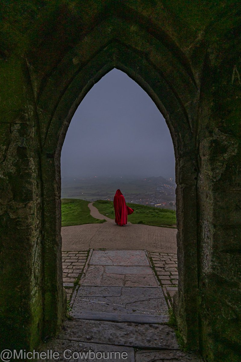 Glastomichelle's tweet photo. Figure in the mist this morning on Glastonbury Tor. taken from the archway of St Michael's tower about 20 minutes before sunrise. https://t.co/dRKrT6g47v