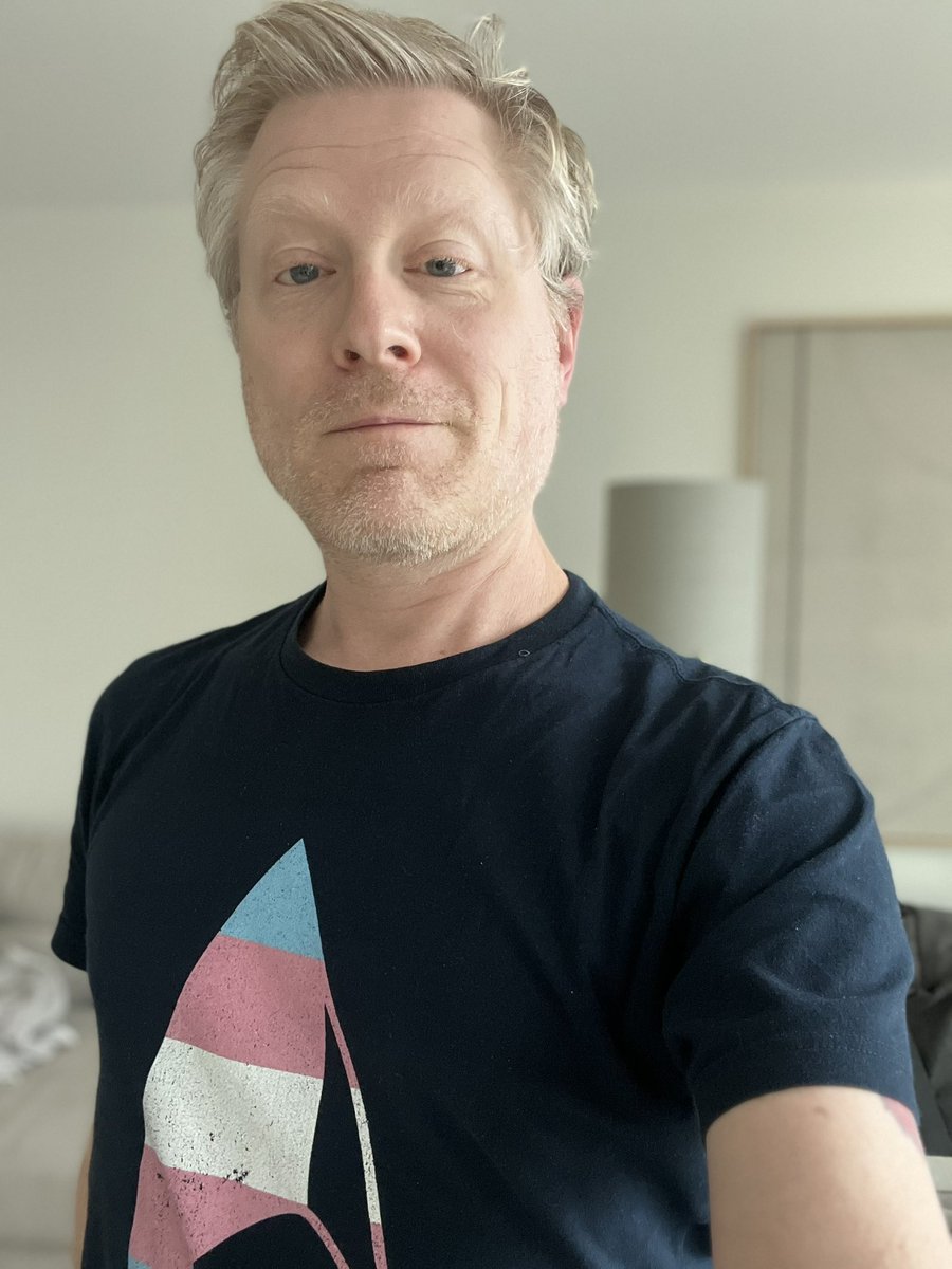 I’m in London today, or I’d be helping GOTV efforts on the ground. Wearing my Trans Flag Starfleet Delta shirt in solidarity with trans &amp; non-binary folks, who will be much better off under a Harris-Walz administration than that of a fascist. Do the right thing. #VoteKamala