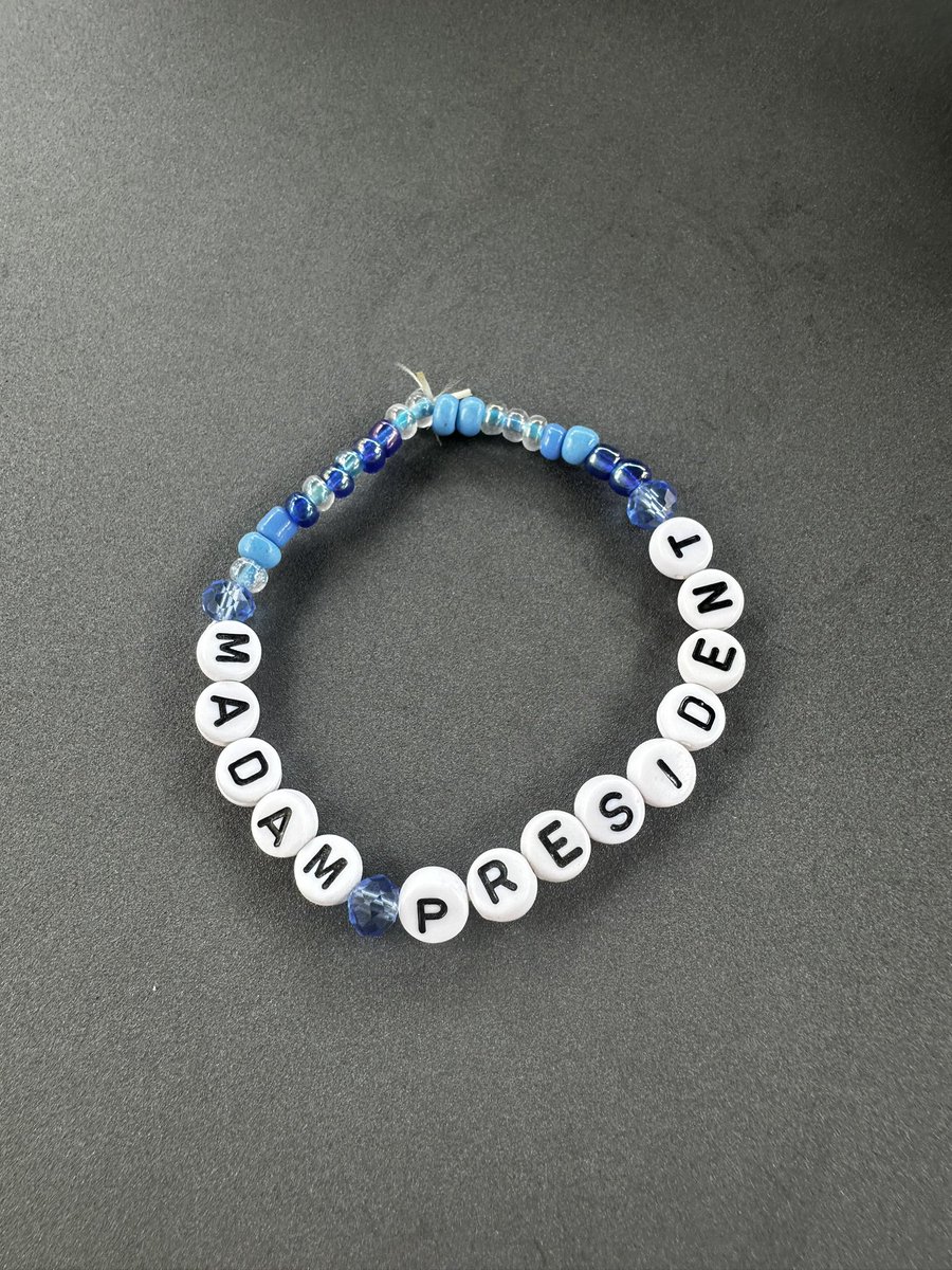 Byte606's tweet photo. @KamalaHQ Friend of friend’s three daughters, ages 7/10/12, made these bracelets to raise money for the VP.  As of early October they had donated more than $5,000.

Today I’m wearing this for my daughter and son and my wife and for all of us. https://t.co/hJd1JVdV3g