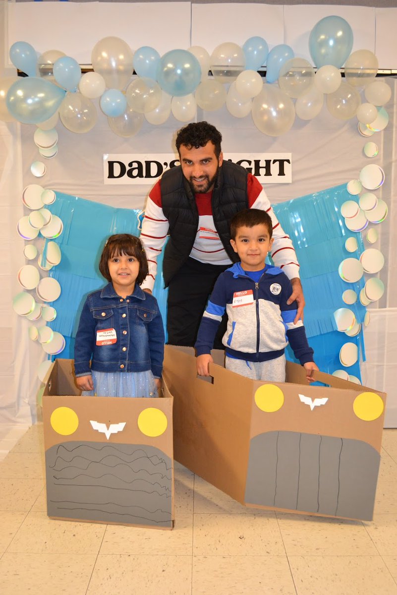 Our Preschool Dad's Night last Friday was a success! Over 50 Dads and their students rotated through stations building each side of their box car. They drove through a car wash obstacle course and finished the evening with a drive in movie, popcorn, and juice! 🚗