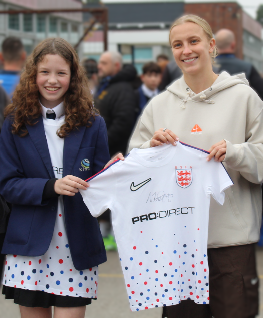 KingsIntColl's tweet photo. We have been keeping a secret....Keslyn in Year 8 won a national competition to design an England football shirt! Today England lioness and Chelsea striker Aggie Beever-Jones, presented the shirt - created in collaboration with Nike - in a special assembly. We are so proud!! https://t.co/YIlN03Su6D