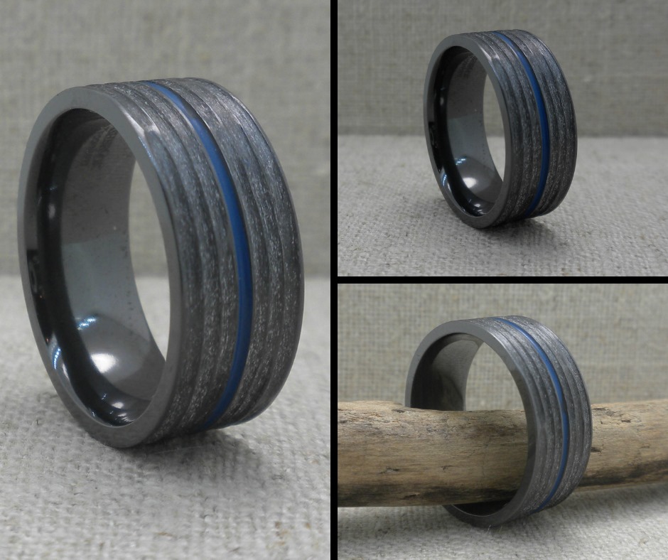 UniqueTitanium's tweet image. Love this one! Black Zirconium Wedding Ring with 1 mm Thin Blue Line Inlay and Tree Bark Finish uniquetitaniumweddingrings.com/black-zirconiu…