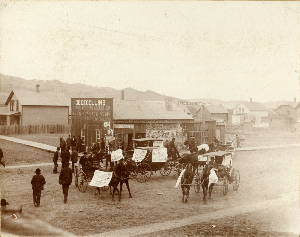 Outside the Geo. T. Collins Carriage and Wagon shop. Political endorsement banners are affixed to carriages and horses. Reverse reads, "Election day in Livingston about 1892. This is one of three voting precints." mtmemory.org/nodes/view/782… #Montana #History #ElectionDay